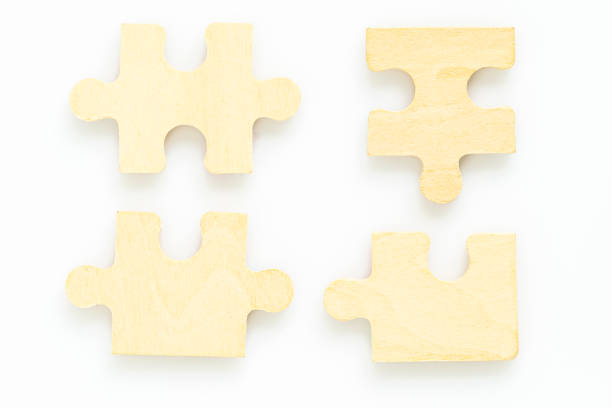 istock wooden jigsaw puzzle pieces on white background 1207010948