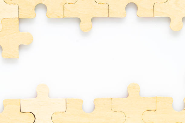 istock wooden jigsaw puzzle pieces on white background 1207010949