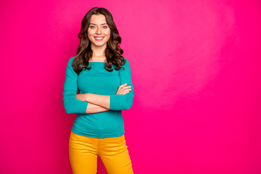 Photo of charming pretty girlfriend smiling, toothily beaming with arms crossed isolated over pink vivid color background