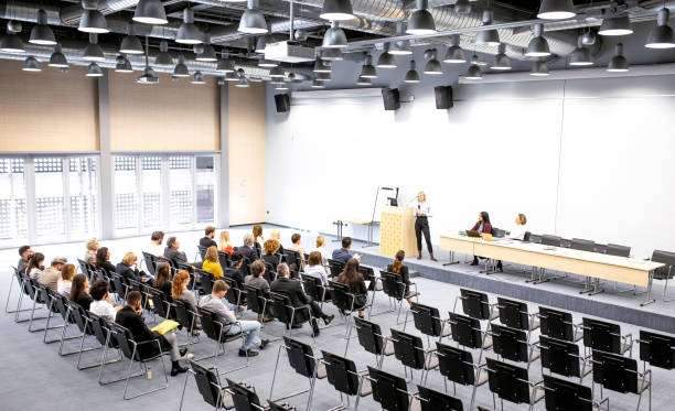 istock Business people at a conference event 1207018084
