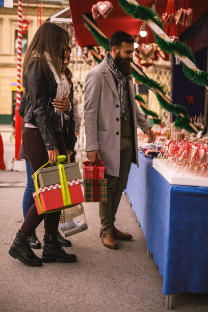 istock Selecting the best candy Chirstmas candies with friends 1207019831