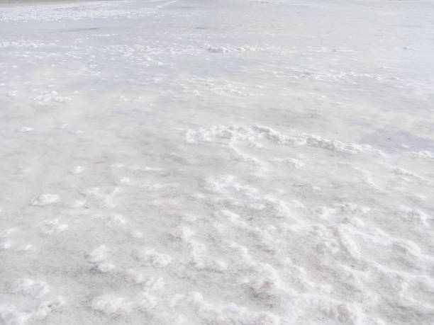 istock Natural white background. Granular crystalline salt desert texture. 1207020287