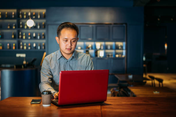 istock Asian businessman working at cafe 1207021431