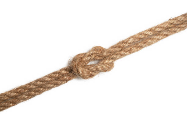 istock Brown jute rope with knot isolated on white background. 1207023112