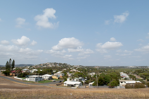 a view of the town of Yeppoon with no people and a blue summer sky with white clouds