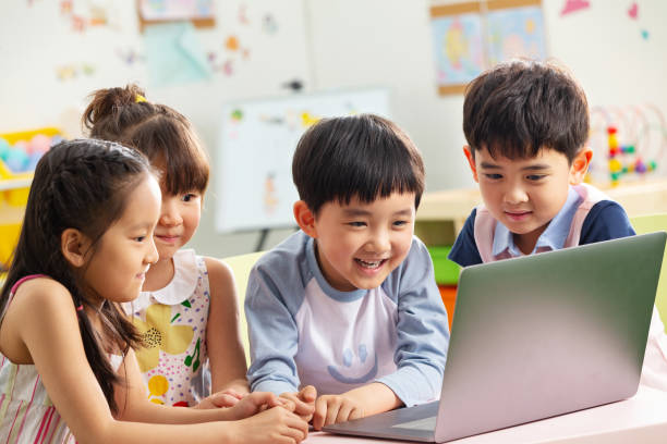 istock The kindergarten children watch video 1207025944