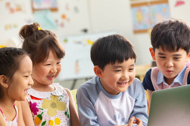 istock The kindergarten children watch video 1207025980