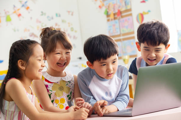 istock The kindergarten children watch video 1207025981