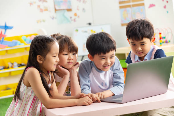 istock The kindergarten children watch video 1207025988