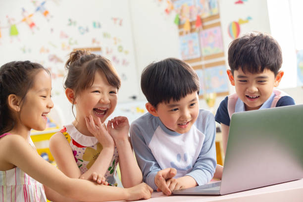 istock The kindergarten children watch video 1207026018