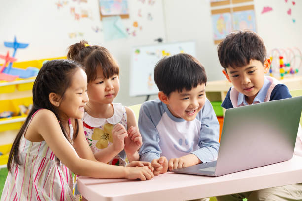 istock The kindergarten children watch video 1207026028