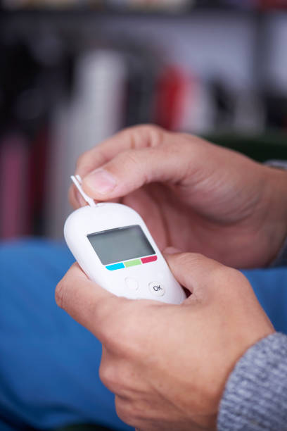 istock man about to measure his blood glucose level 1207026439