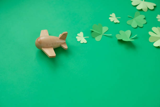 istock St. Patrick's day, Plane luck Shamrock on a green background 1207027395