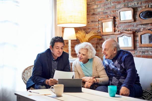 istock Financial advisor explaining couple at home 1207027493