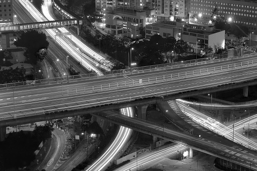 Traffic on highway in downtown in black and white