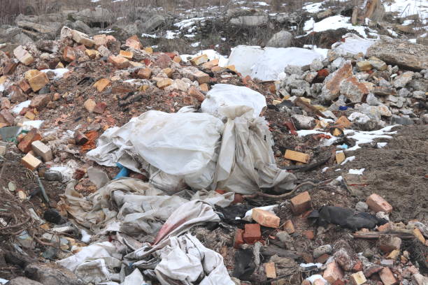 istock Construction waste with elements of various dismantled and destroyed old structures at landfill 1207029810
