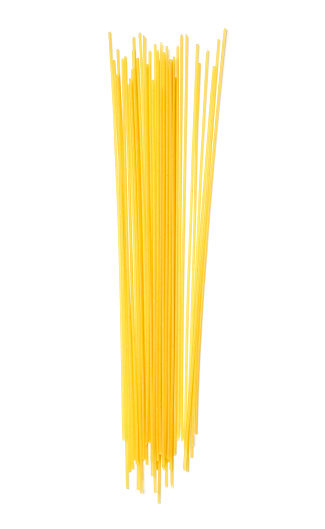 Spaghetti. Yellow pasta, ready for cooking. Isolated white background. Top view, flat lay