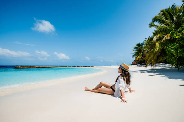 istock Attractive woman on beach 1207034970