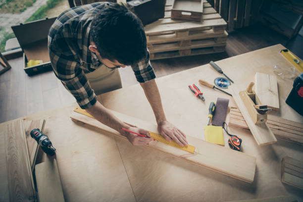 istock Above high angle view portrait of his he nice attractive focused skilled experienced hardworking guy creating building project at home modern industrial loft brick style interior indoors 1207034971