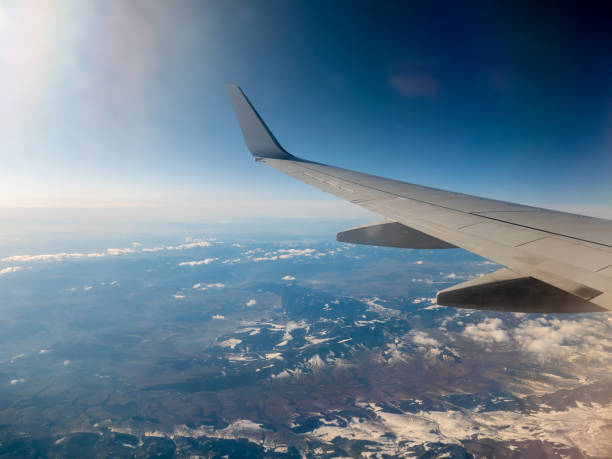 istock View on airplane wing and Tatry mountains by Poland side 1207035348