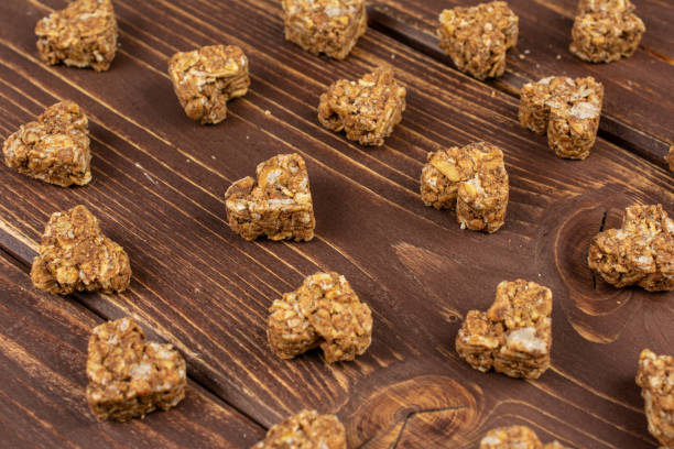 istock Cereal cocoa heart on brown wood 1207036377