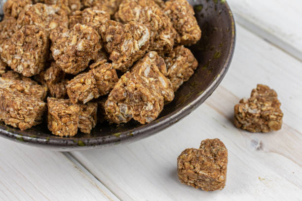 istock Cereal cocoa heart on grey wood 1207036542