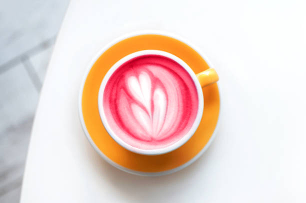 istock Cup of trendy beetroot latte on table. 1207037889