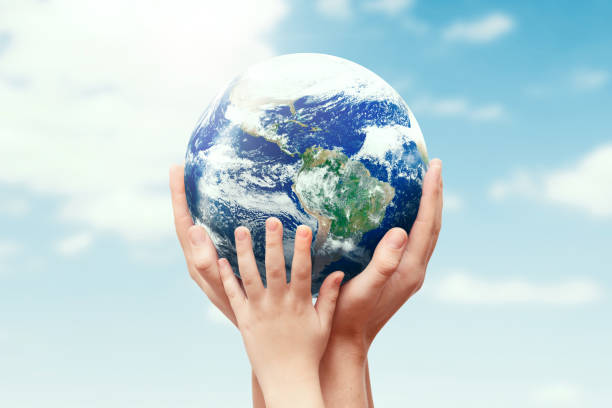 istock Earth globe in family hands. World environment day 1207037958