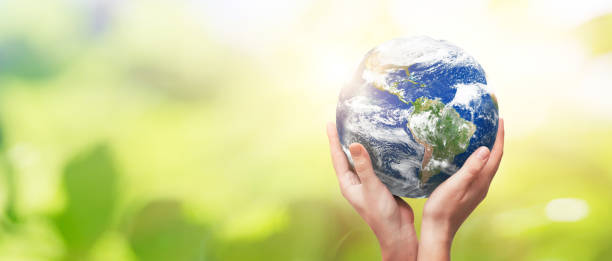 istock Earth globe in family hands. World environment day 1207037980
