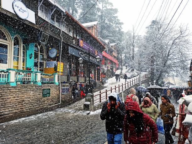 View of the market in small town named Shimla during winters 2020, in the Northern part of India. This town is also known for summer capital of India during the British rule. View of the market in small town named Shimla during winters 2020, in the Northern part of India. This town is also known for summer capital of India during the British rule. himachal pradesh photos stock pictures, royalty-free photos & images