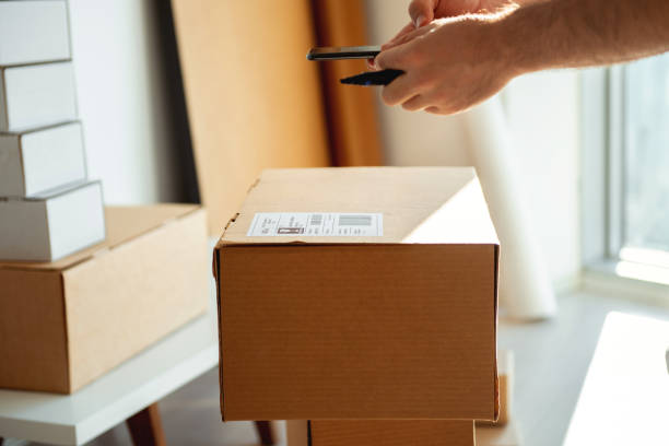 istock Delivery service, scanning a shipping label 1207039048