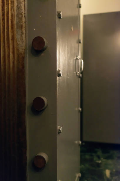 Opened old-fashioned solid vault door of a bank.