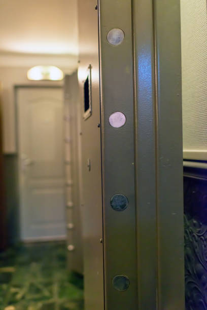 istock Opened old-fashioned solid vault door of a bank. 1207041210