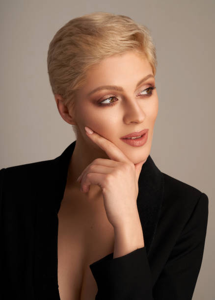 istock confident blonde woman in black jacket 1207042131