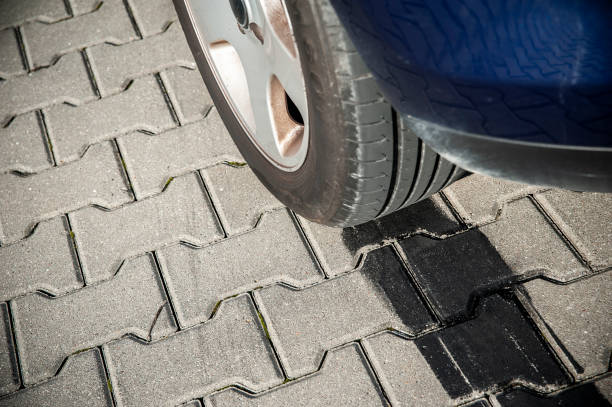 istock Black tire tracks on the pavement after drifting 1207043925