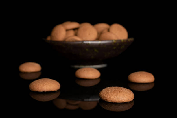 istock Chocolate sponge biscuit isolated on black glass 1207045508