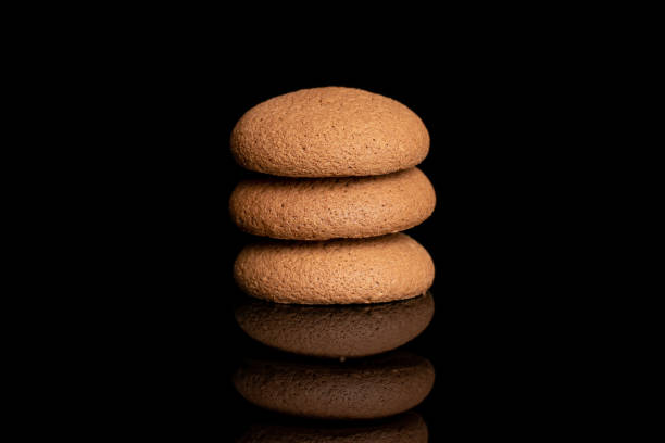 istock Chocolate sponge biscuit isolated on black glass 1207046470