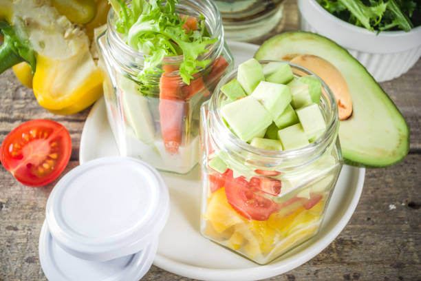 istock Healthy vegetable salad in jars 1207046507