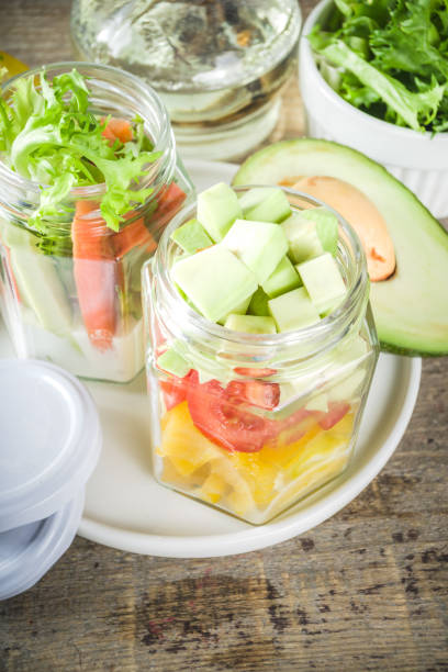 istock Healthy vegetable salad in jars 1207046533