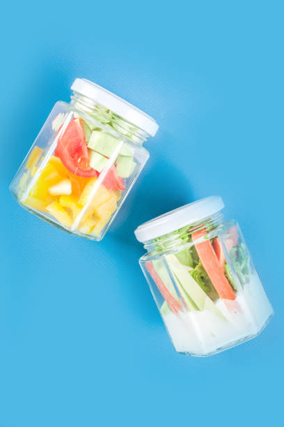 istock Healthy vegetable salad in jars 1207046619