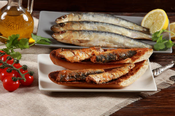 istock Fresh Sardines on Toasted Bread making a Spanish Tapas 1207047114