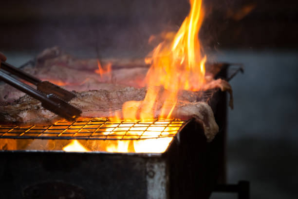 istock Roast pork on a charcoal flame. 1207048354