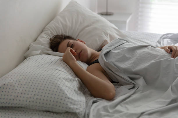 istock Women sleeping at the morning on her bed 1207050027
