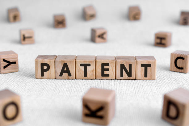 istock Patent - words from wooden blocks with letters 1207052690