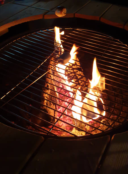 istock night marshmallow cooking on a table brazier 1207052720