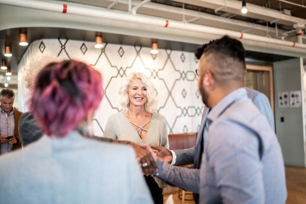 istock Business people shaking hands at business event 1207054815