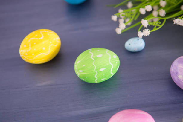 istock Easter eggs decoration with and flowers on gray wooden table. 1207055075