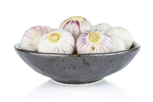 istock Single clove garlic isolated on white 1207056485