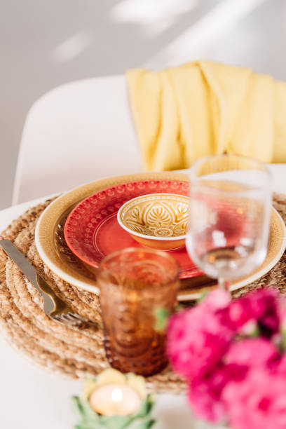 istock Colorful place setting indoors in dining room on kitchen table crockery and cutlery 1207057430