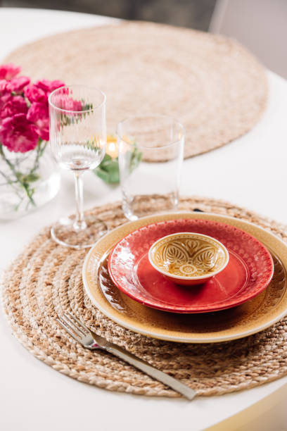 istock Colorful place setting indoors in dining room on kitchen table crockery and cutlery 1207057564